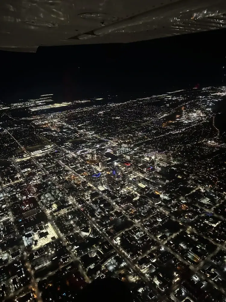 Above view of a city at night from an airplane