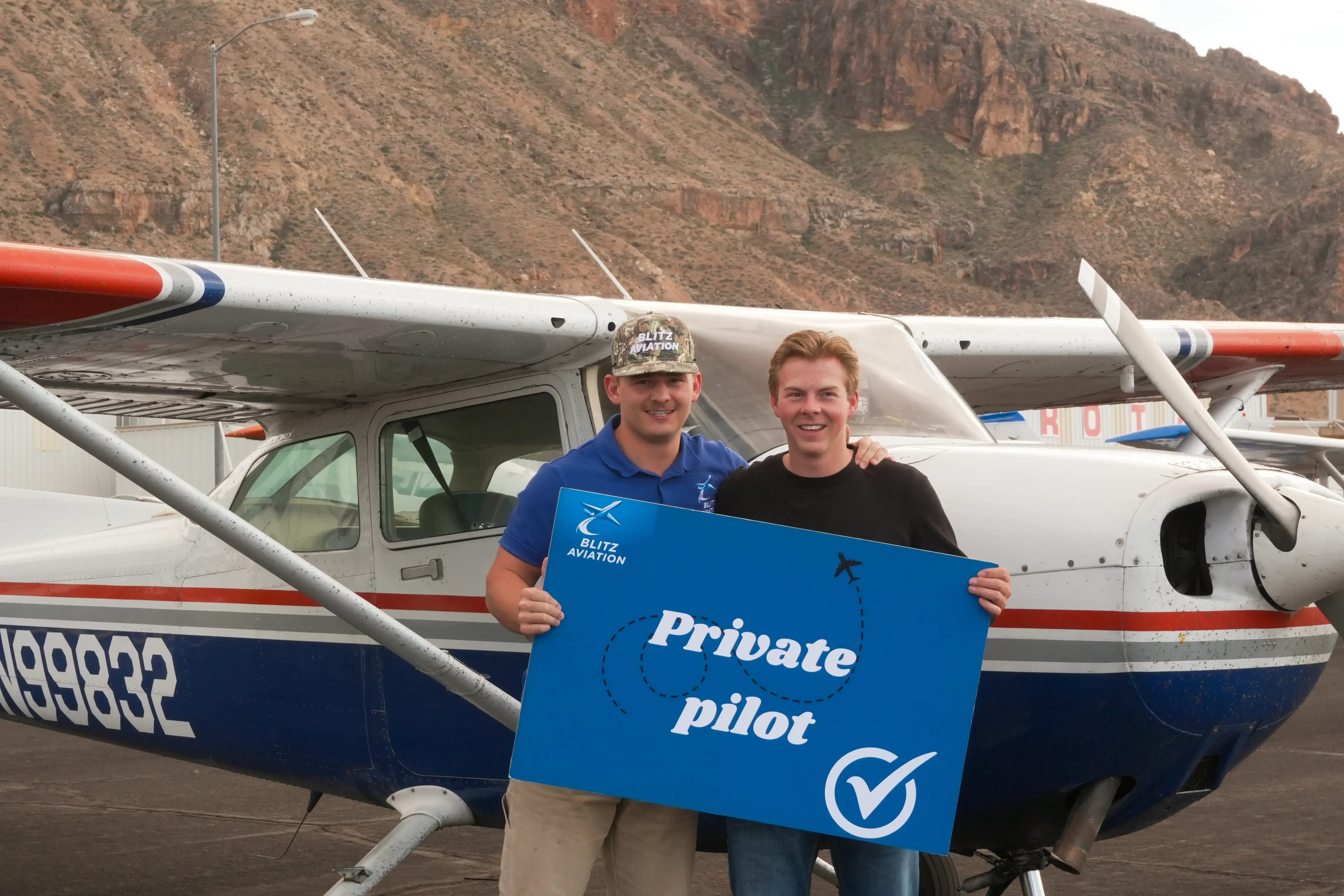 Student with cfi after a private pilot license at the hangar at Blitz Aviation
