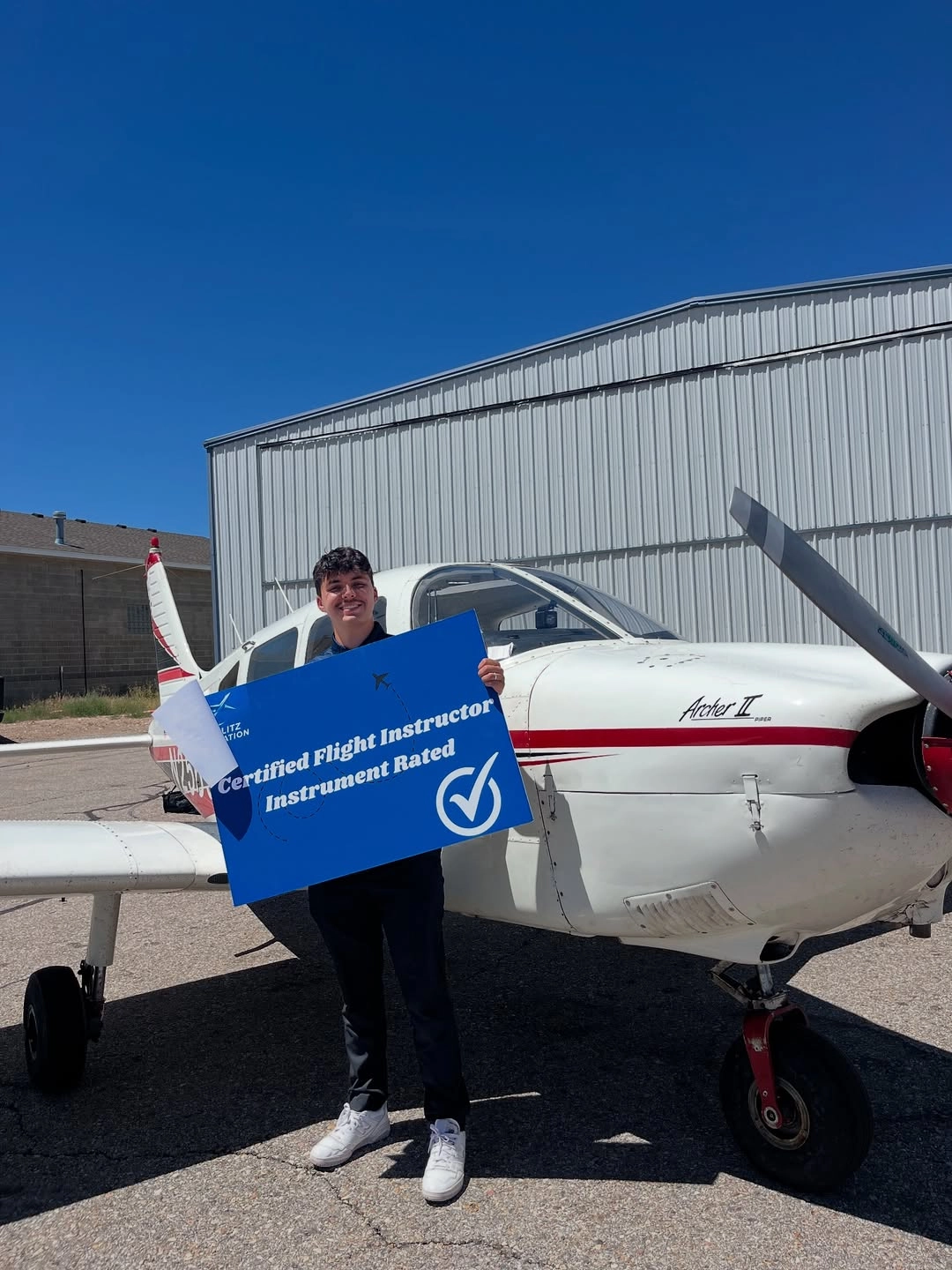 Student Avery celebrating passing their CFII checkride at Blitz Aviation in Salt Lake City as part of the zero to hero pilot program